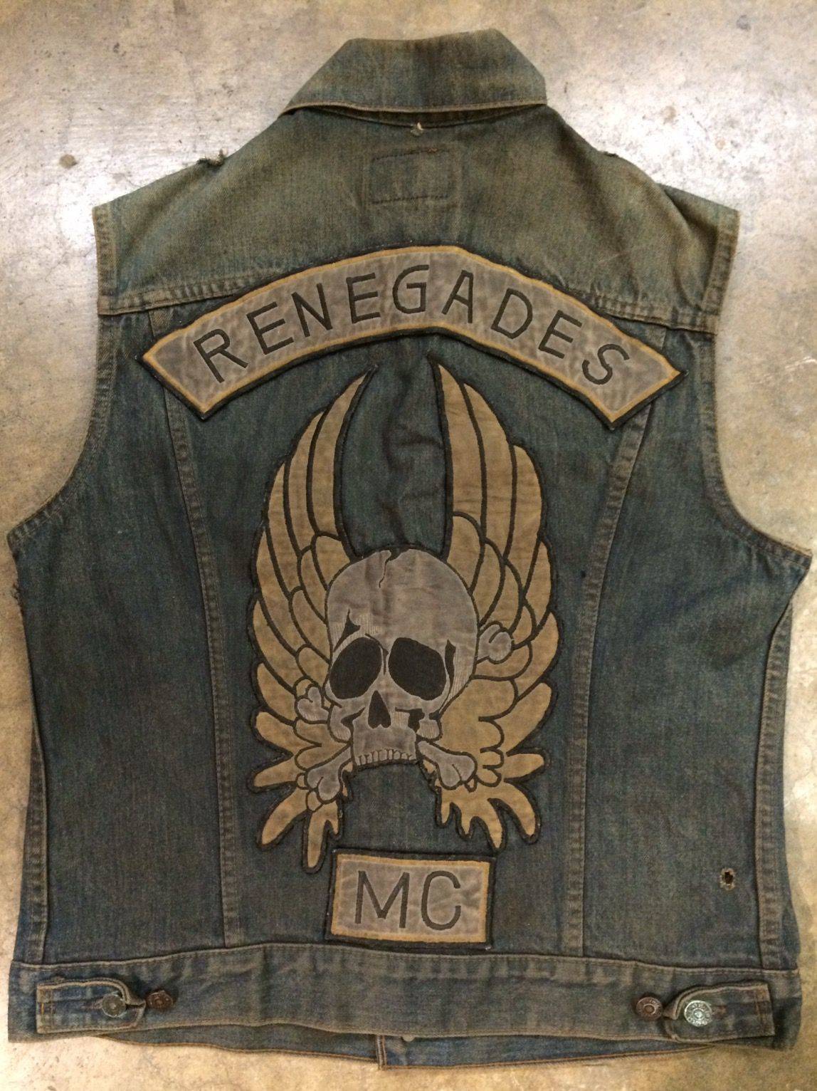 A denim vest has the Renegades logo and insignia ironed onto the back.