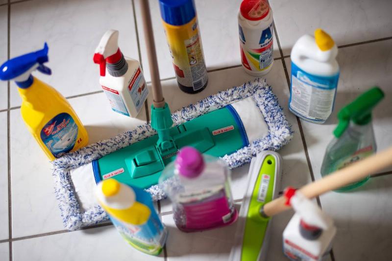 cleaning products on floor with wiper