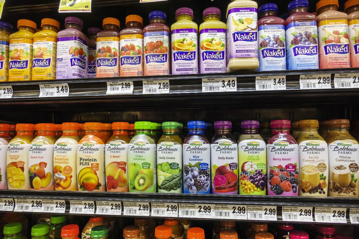 Shelves of packaged smoothies are seen at a supermarket.