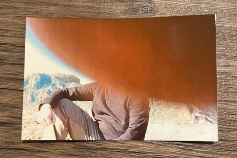 film photo with thumb covering half the picture