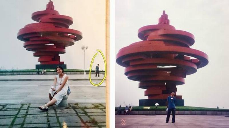 couple take picture at same monument