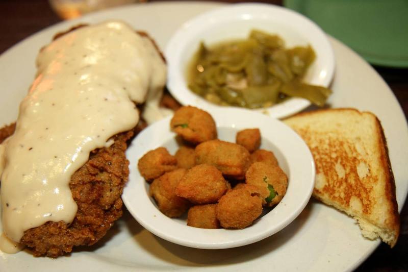 Plates of food from Cowboy's Bar-B-Q and Steak Company.