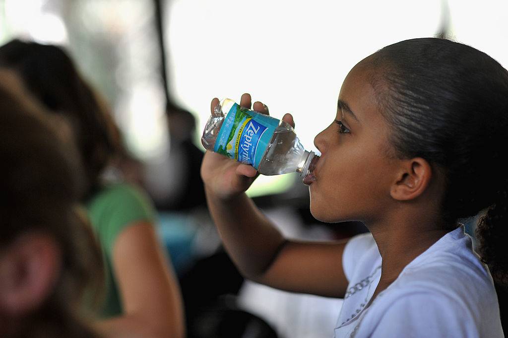 a student drinking Zephyrhills water