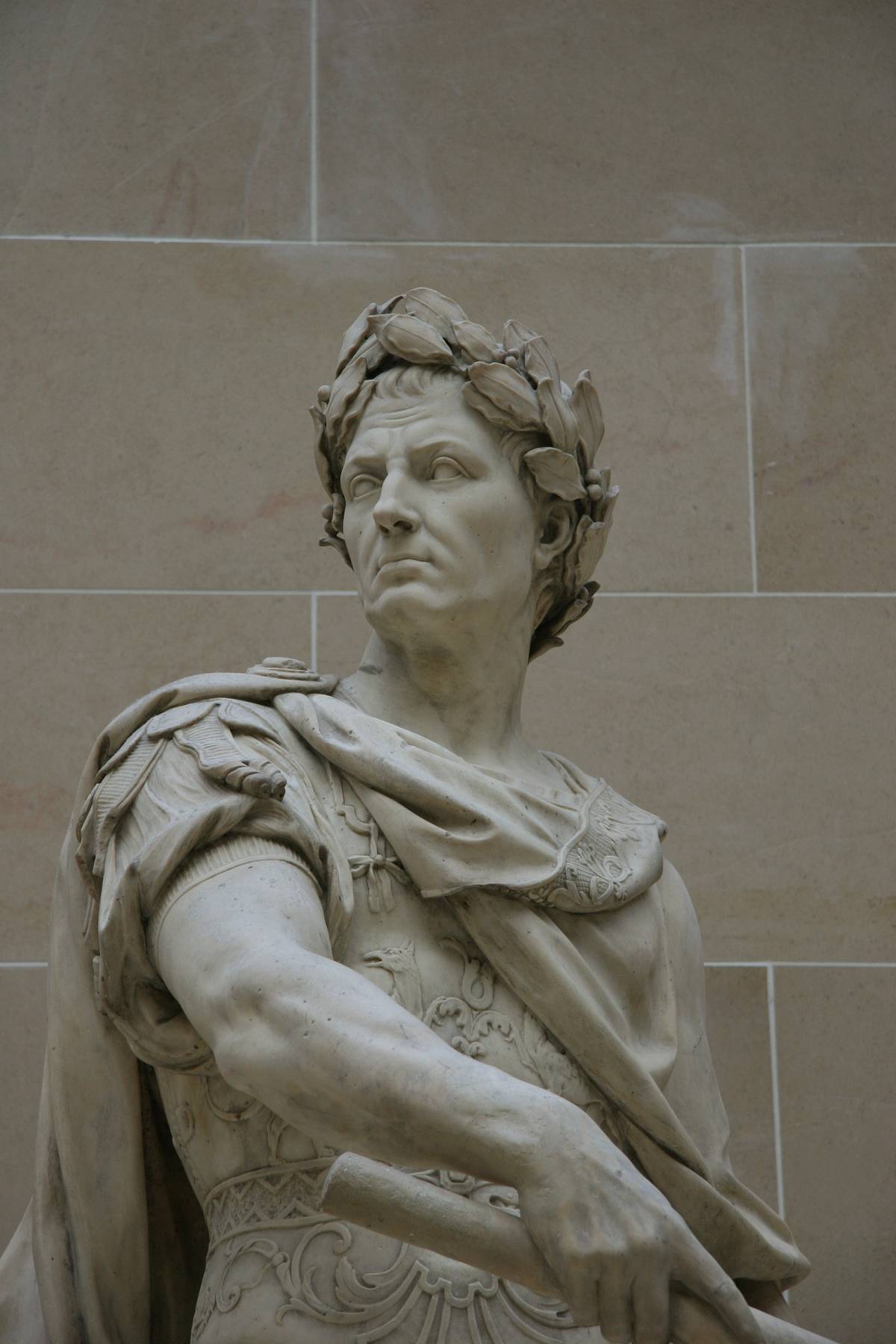 A marble statue depicts a Roman ruler.