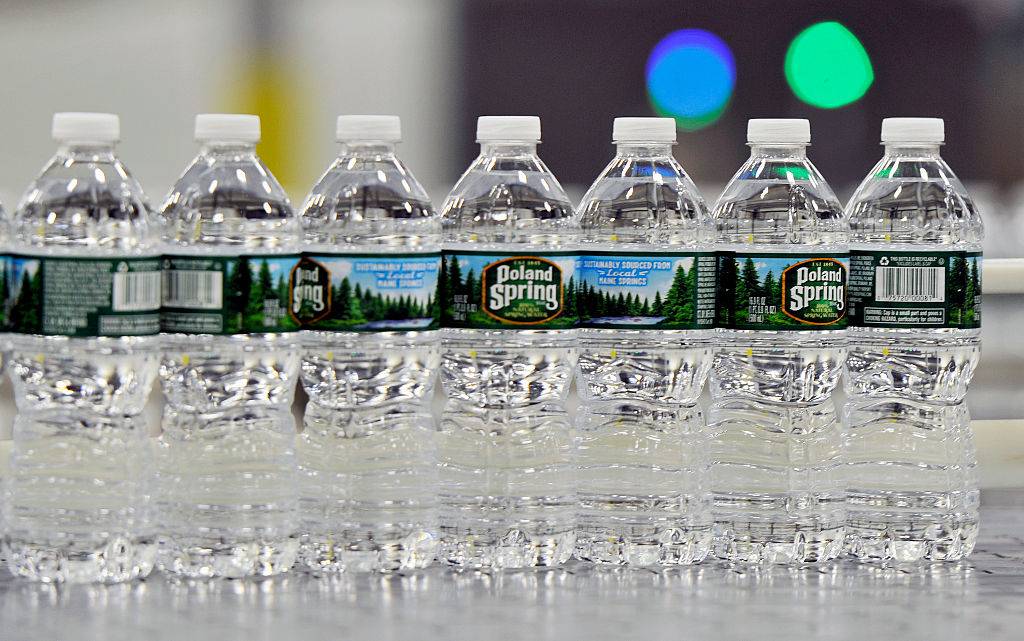 Bottles of Poland Spring water on a conveyer belt