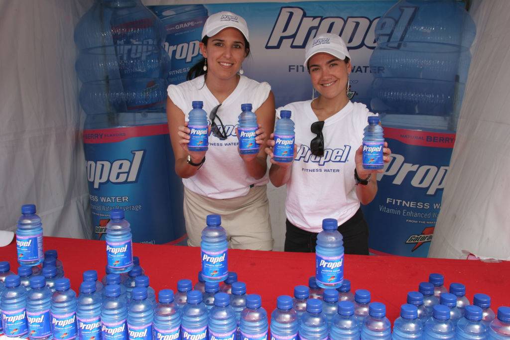 Two women handing out free Propel bottled fitness water