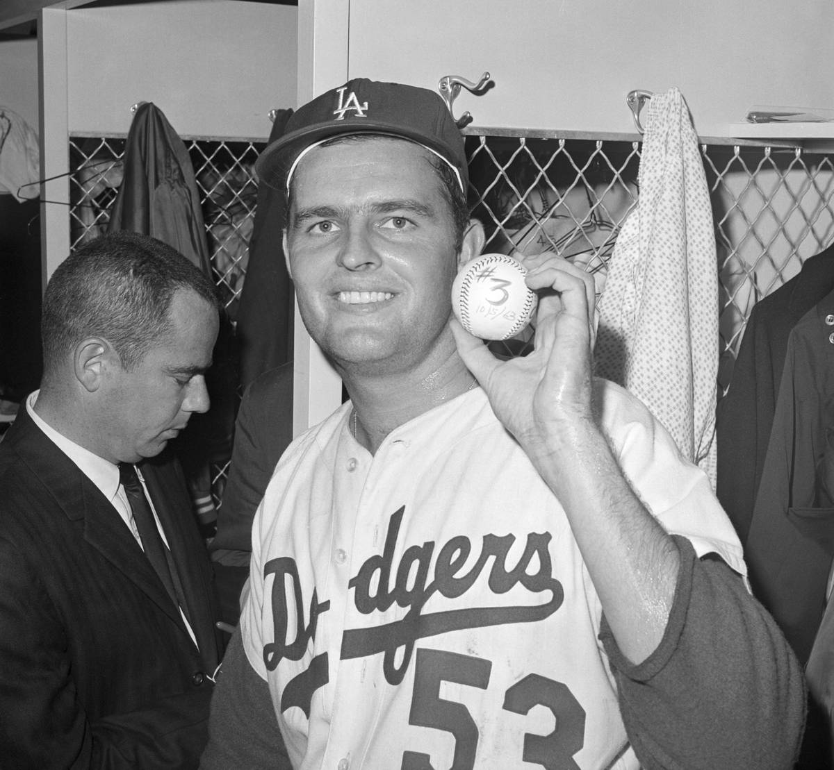 Don Drysdale Holds Up Baseball