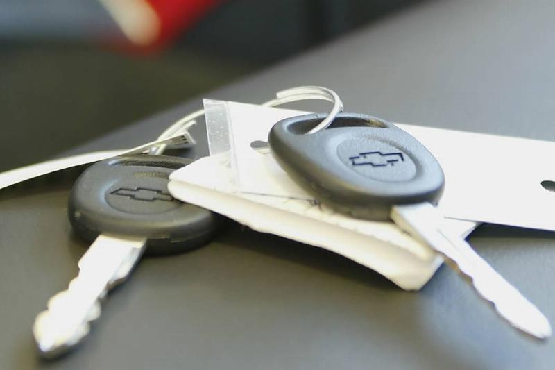 Keys lay on the seat of a car in the showroom of Byers Chevr