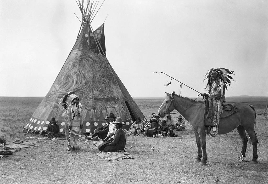 encampment on the Great Plaines with a teepee and man on horseback