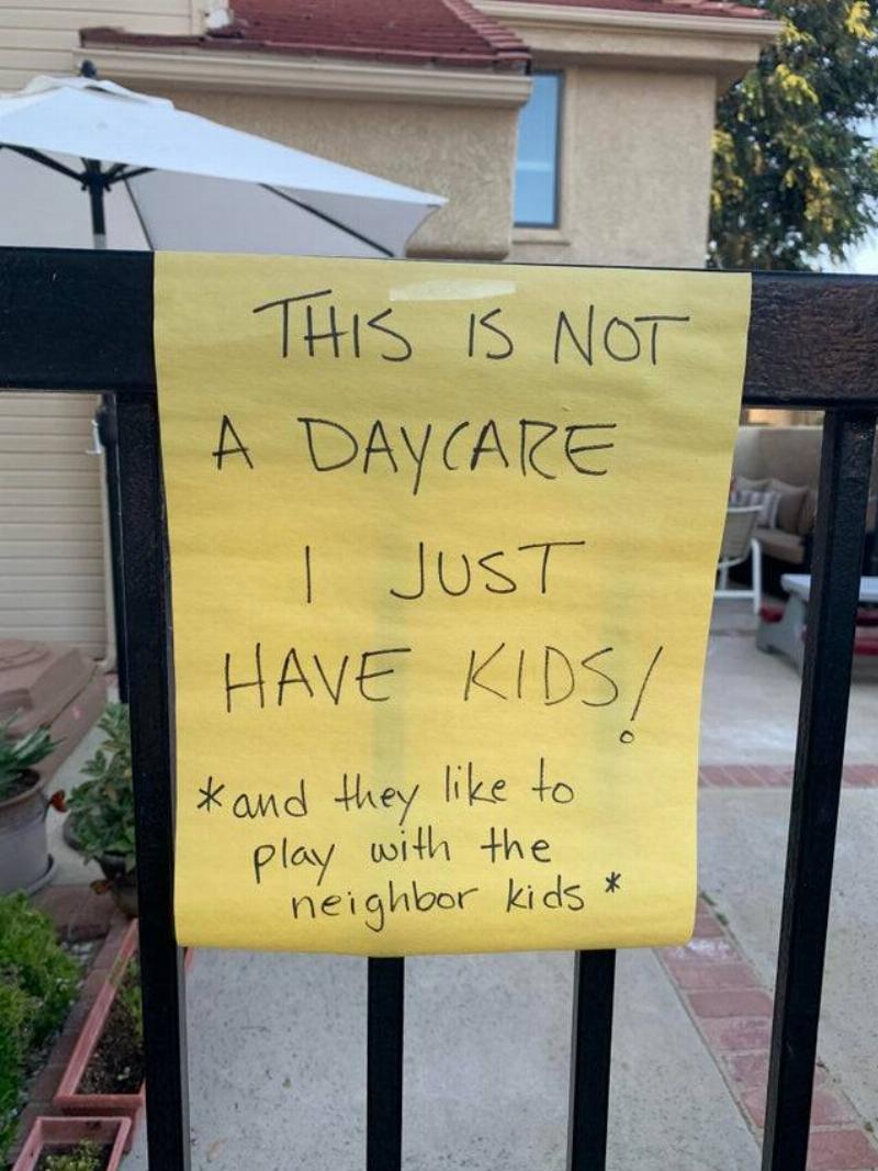 Sign on fence saying it is not a daycare.