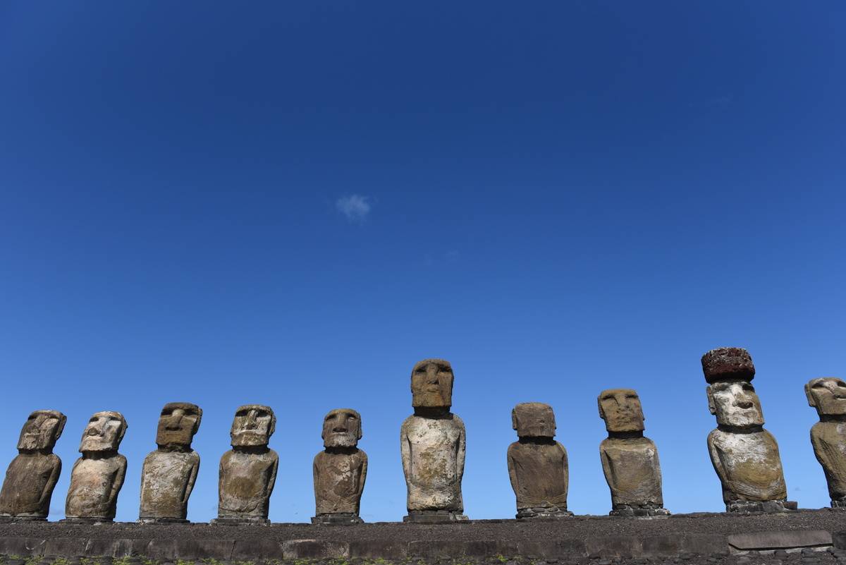 Moais seen at ceremonial platform Ahu Tongariki at Rapa Nui...