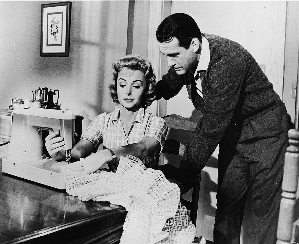 man and woman with a sewing machine