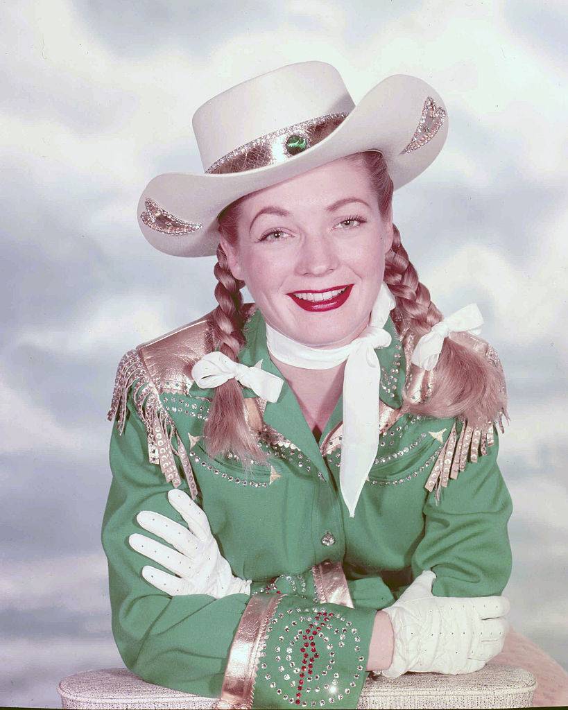 woman dressed in cowgirl outfit