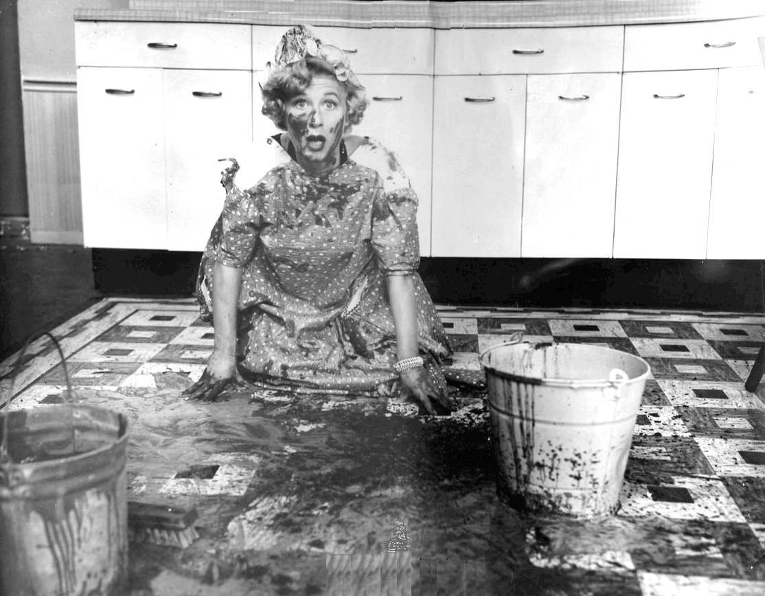 woman covered in mud on kitchen floor