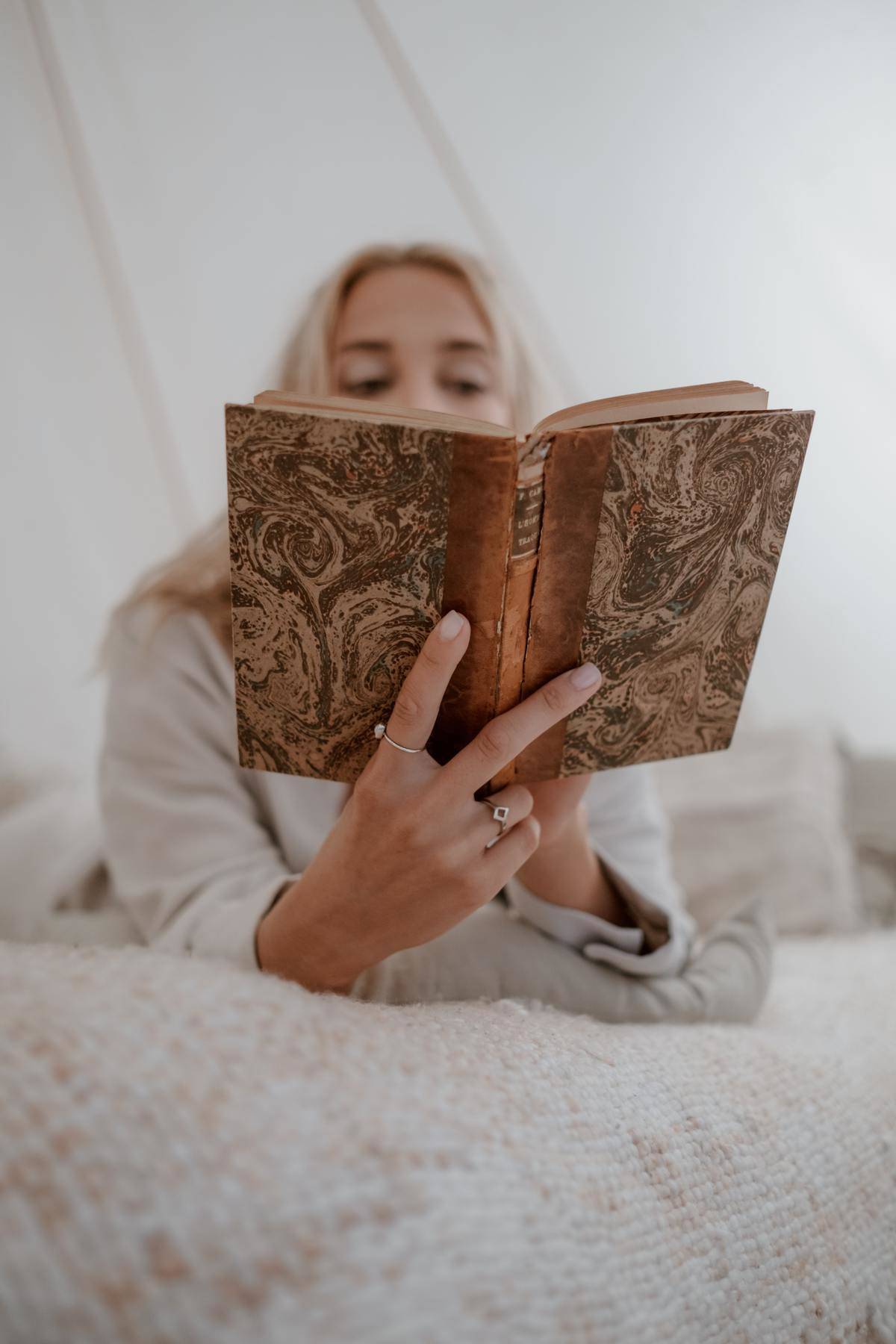 Woman reading vintage cover book 