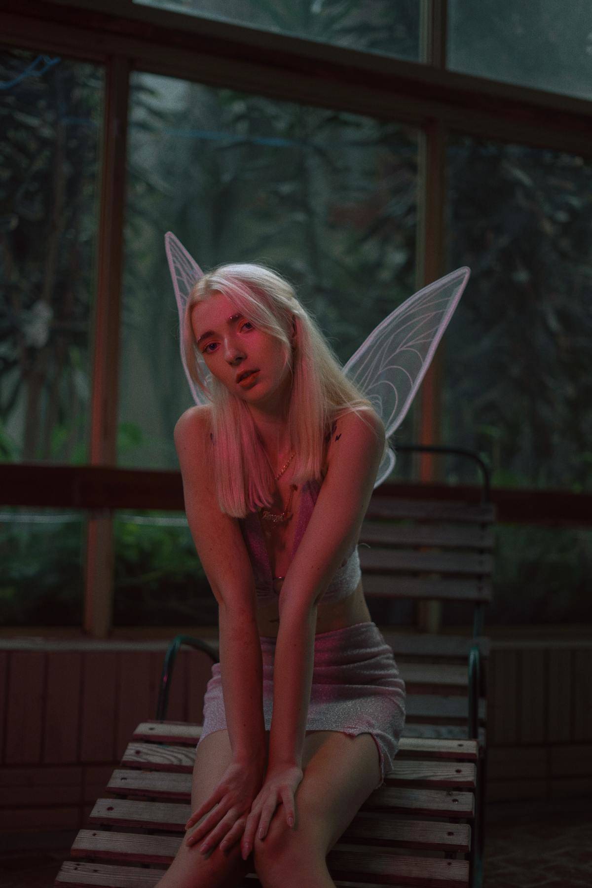Woman with blonde hair and fairy wings