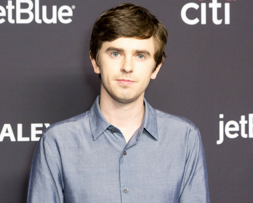 Freddie Highmore poses for photographers at event