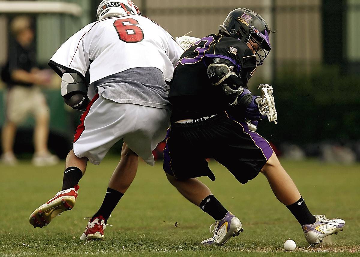 Men playing lacrosse