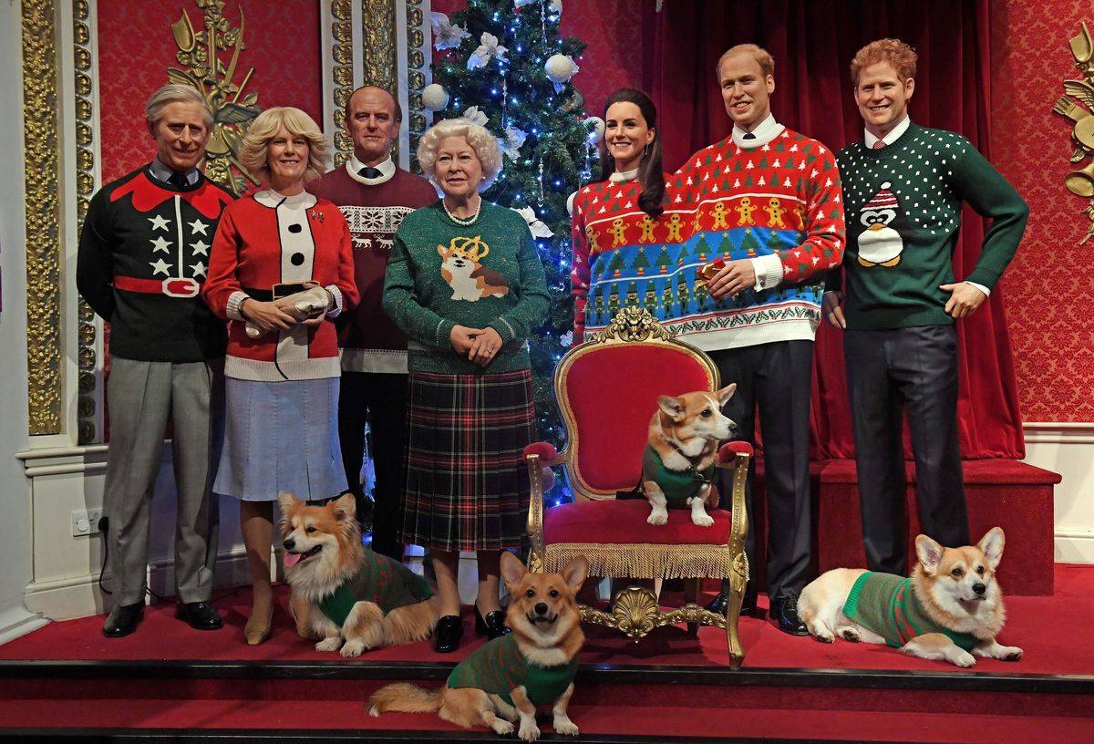 Corgi dogs join wax figures of members of the Royal family in Madame Tussauds, London, wear their Christmas jumpers to raise awareness of Save the Children.