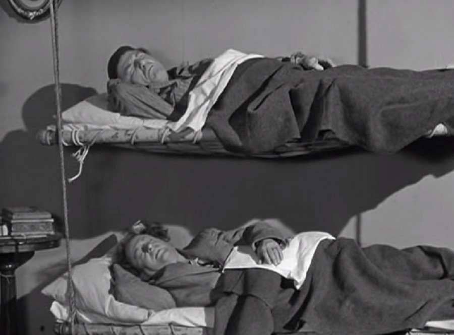 Still image from The Three Stooges of actors in bunk beds 