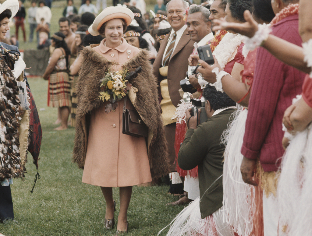 The Queen on tour wears fur cloak gifted to her