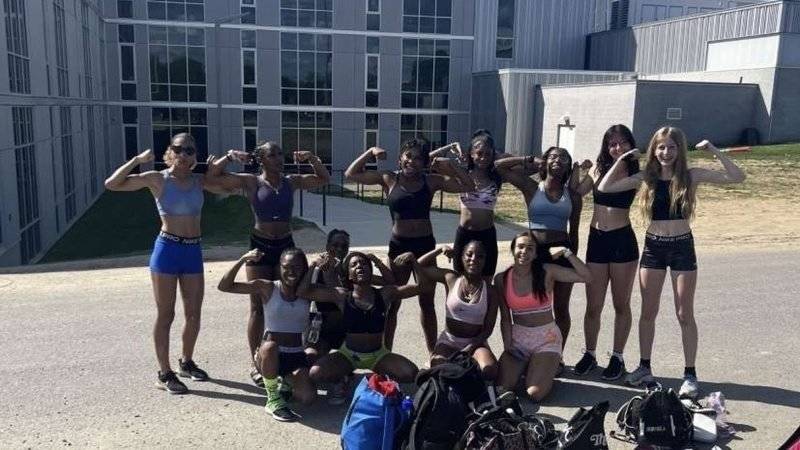 High school women's track team wearing shorts and sports bras 