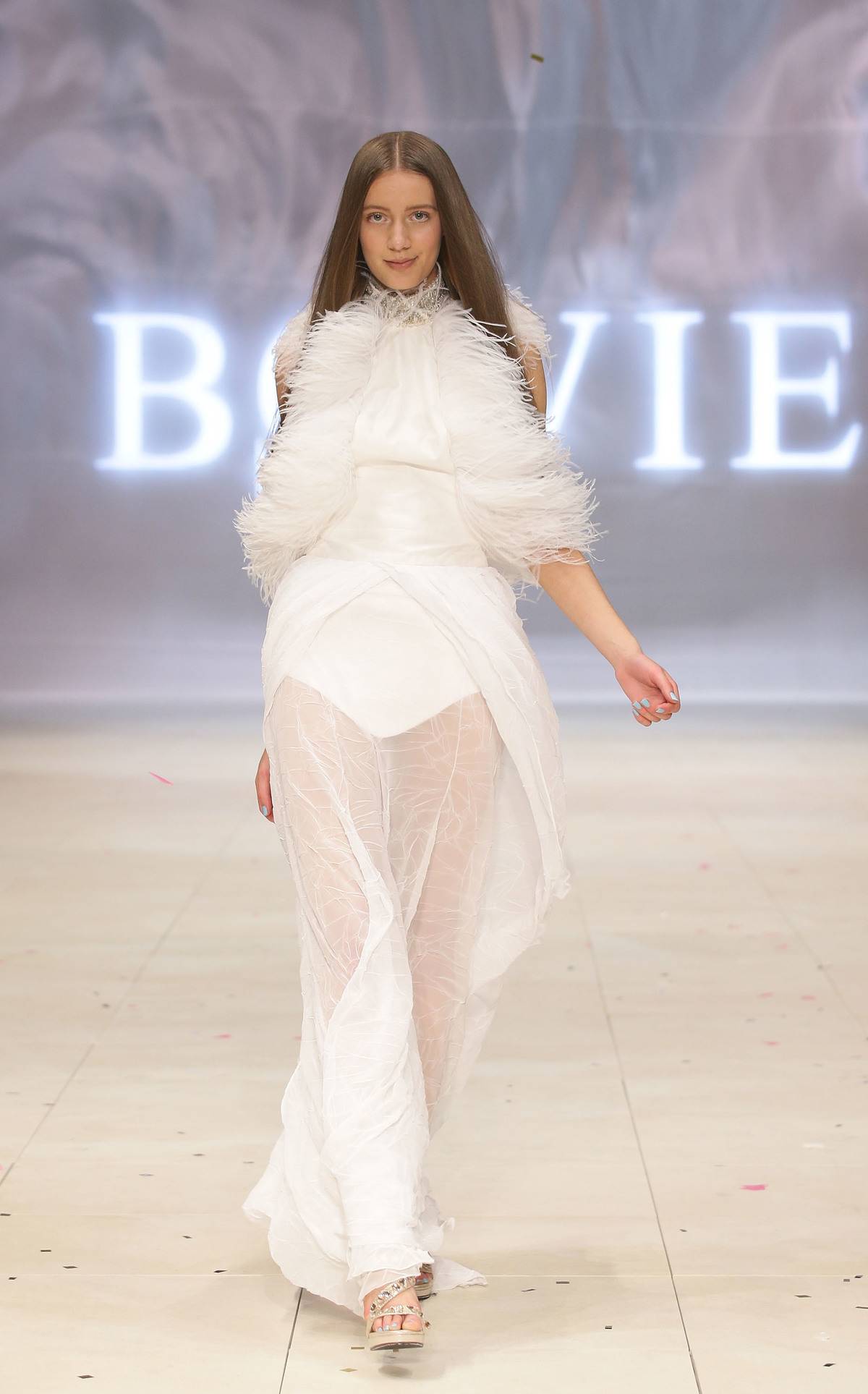SYDNEY, AUSTRALIA - AUGUST 21: A model showcases designs by Bowie on the catwalk as part of Mercedes Benz Fashion Festival Sydney 2012 at Sydney Town Hall on August 21, 2012 in Sydney, Australia.