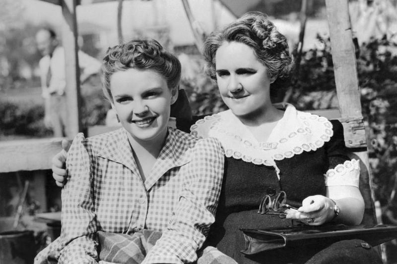 Judy Garland's mother visits the young star on the set of her new starring picture Little Nellie Kelly at Metro Goldwyn Mayer studios. The film is directed by Norman Taurog, and produced by Arthur Freed.