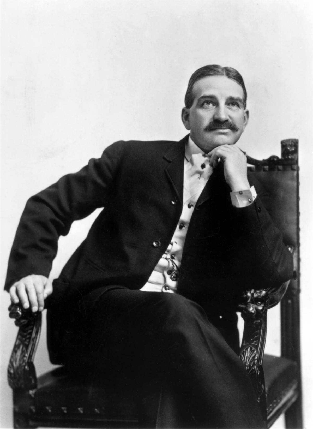 Seated portrait of L. Frank Baum (1856 - 1919), author of 'The Wonderful Wizard of Oz', circa 1910.