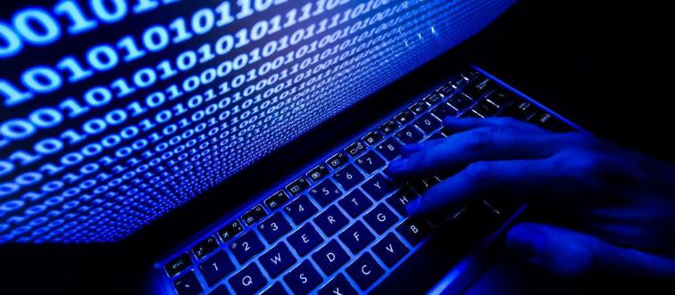 Person coding on computer