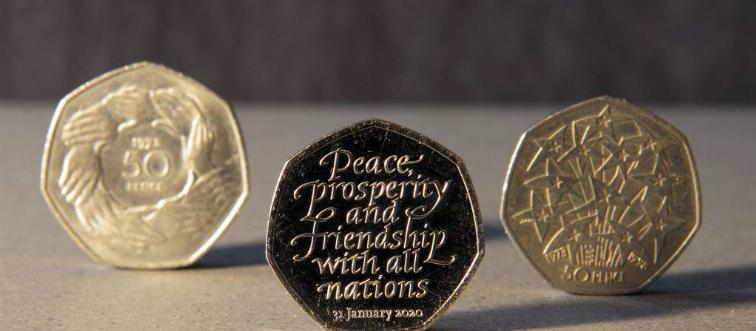 Heptagon coin with writing 