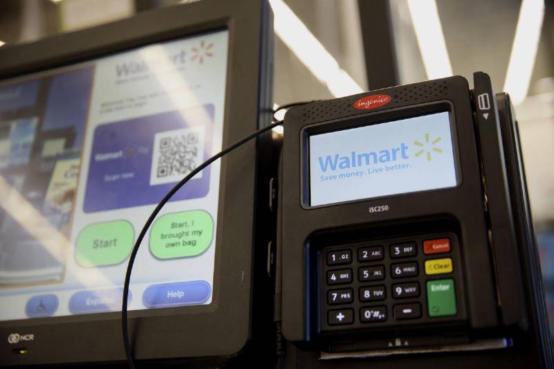 The Wal-Mart Stores Inc. logo is displayed on a self-checkout kiosk