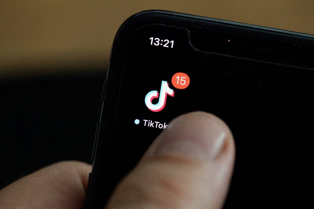 This illustration picture taken on May 27, 2020 in Paris shows the logo of the social network application Tik Tok on the screen of a phone.
