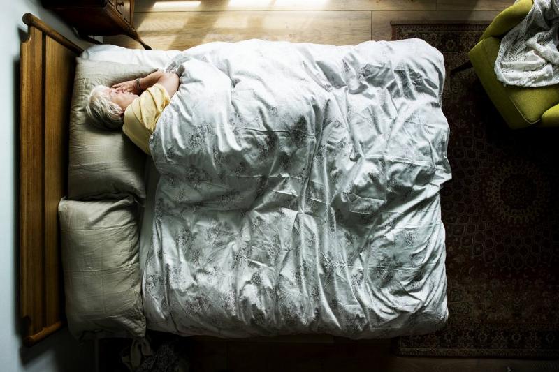 elderly-caucasian-woman-sleeping-on-the-bed-2022-09-16-09-04-49-utc