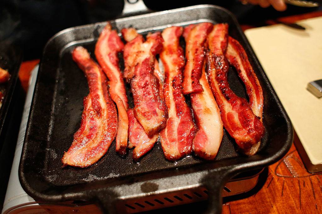 bacon grilling in a pan