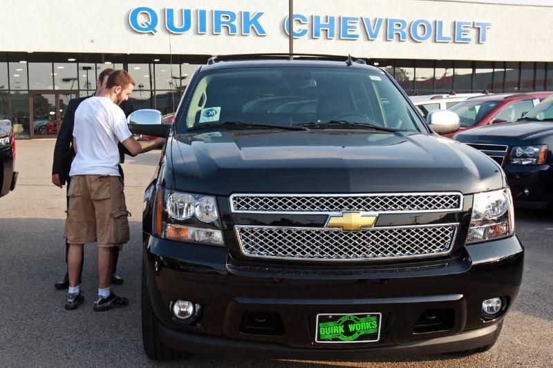 Braintree, MA ? Salesman Tareq Alalam shows Tom Cabral a 2011 Chevrolet Avalanche model at the Quirk Chevrolet dealership in Quincy Street on Thursday, May 26, 2011. Staff Photo by Matthew West.