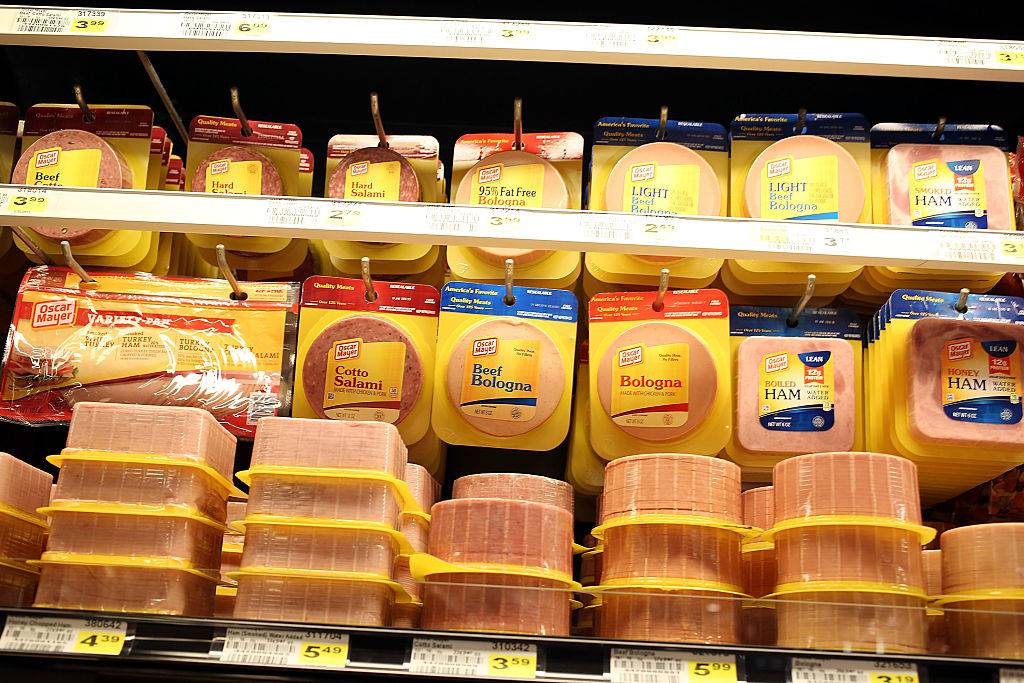 Processed meats are displayed in a grocery store