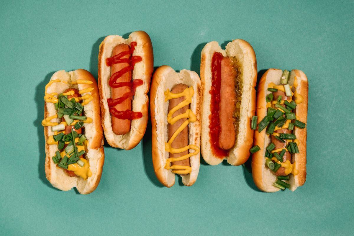 hot dogs with different condiments