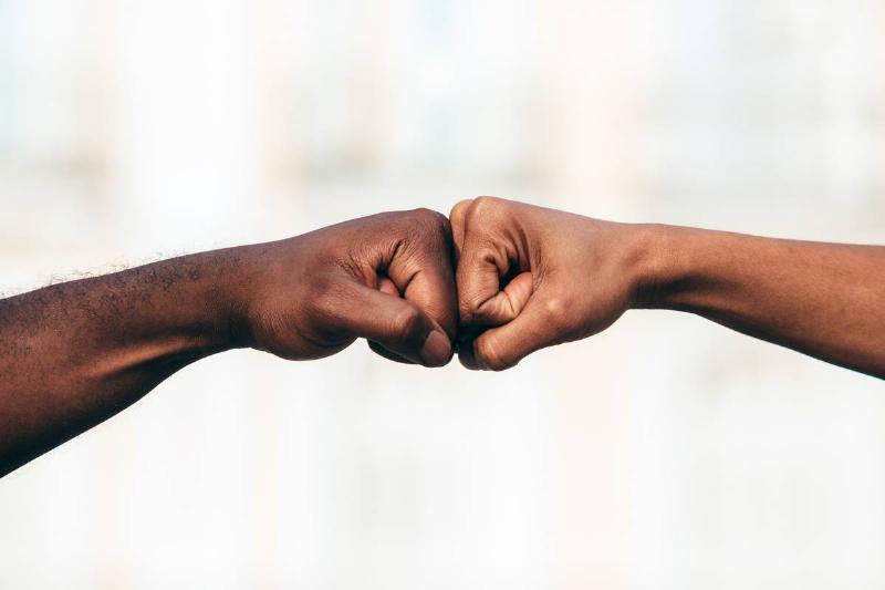 two-black-people-joining-their-fists-2022-03-04-06-13-09-utc