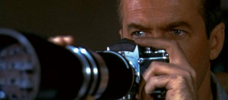 Jimmy Stewart taking photographs as L.B. Jeffries in Rear Window
