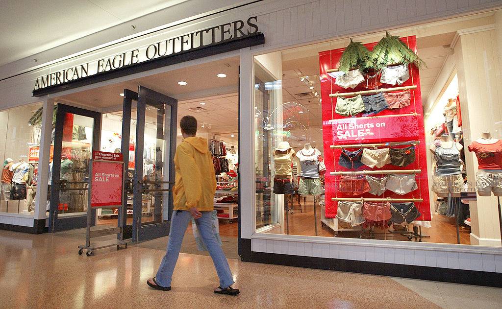 A shopper walks past an American Eagle Outfitters clothing store