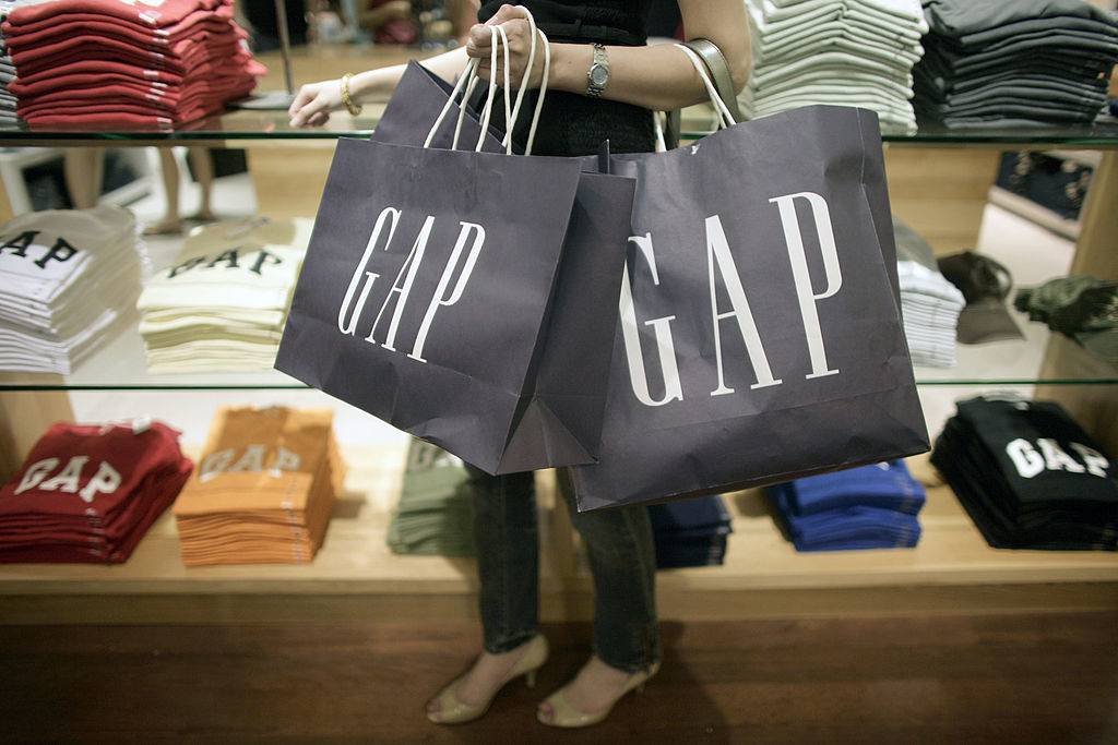 woman carries GAP bags