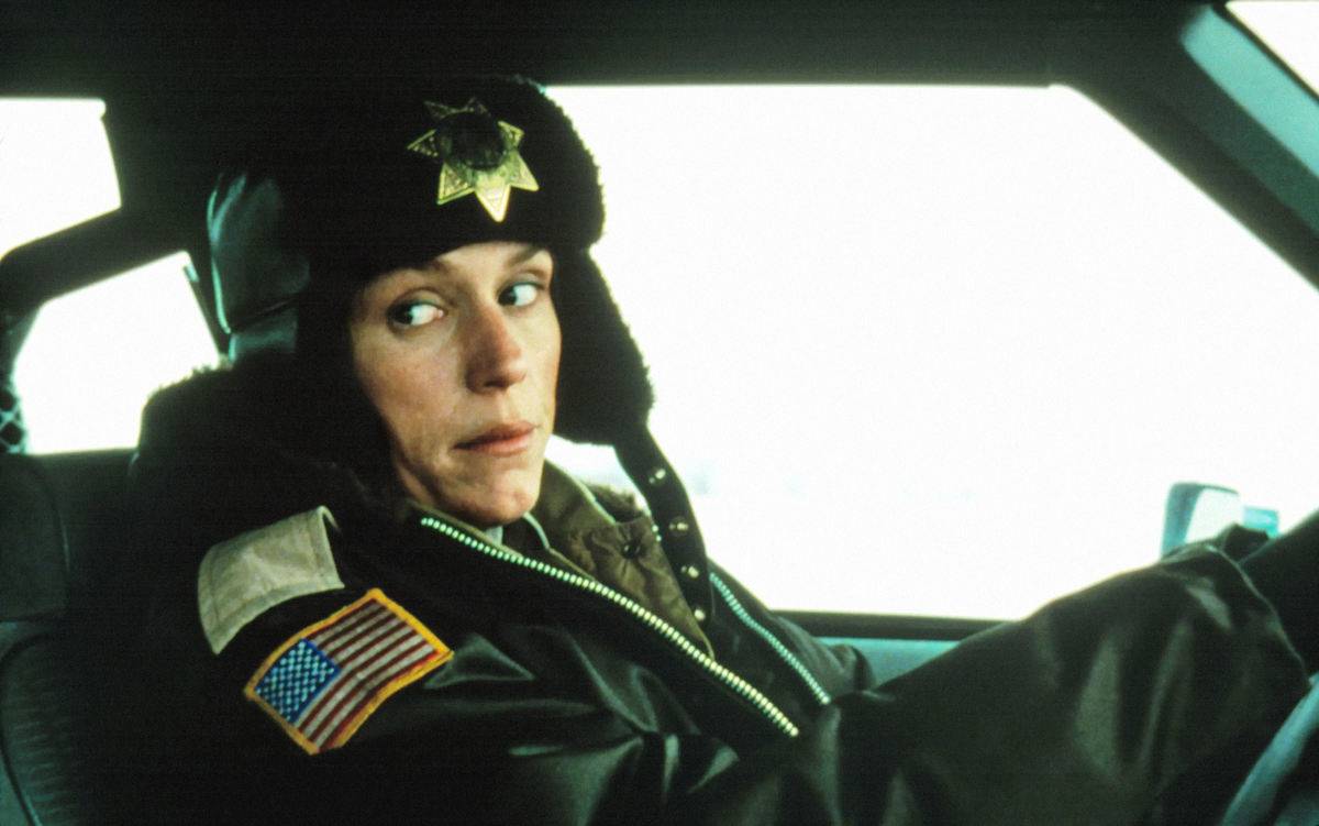 Frances McDormand driving police car as Marge Gunderson in Fargo