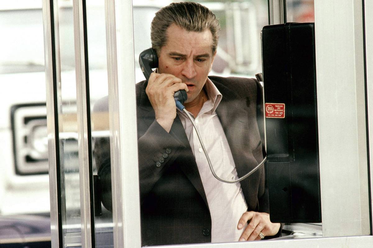 Robert De Niro talking on payphone as Jimmy Conway in Goodfellas