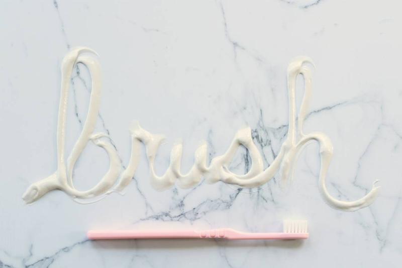 brush-in-toothpaste-with-toothbrush-2022-11-10-22-25-38-utc