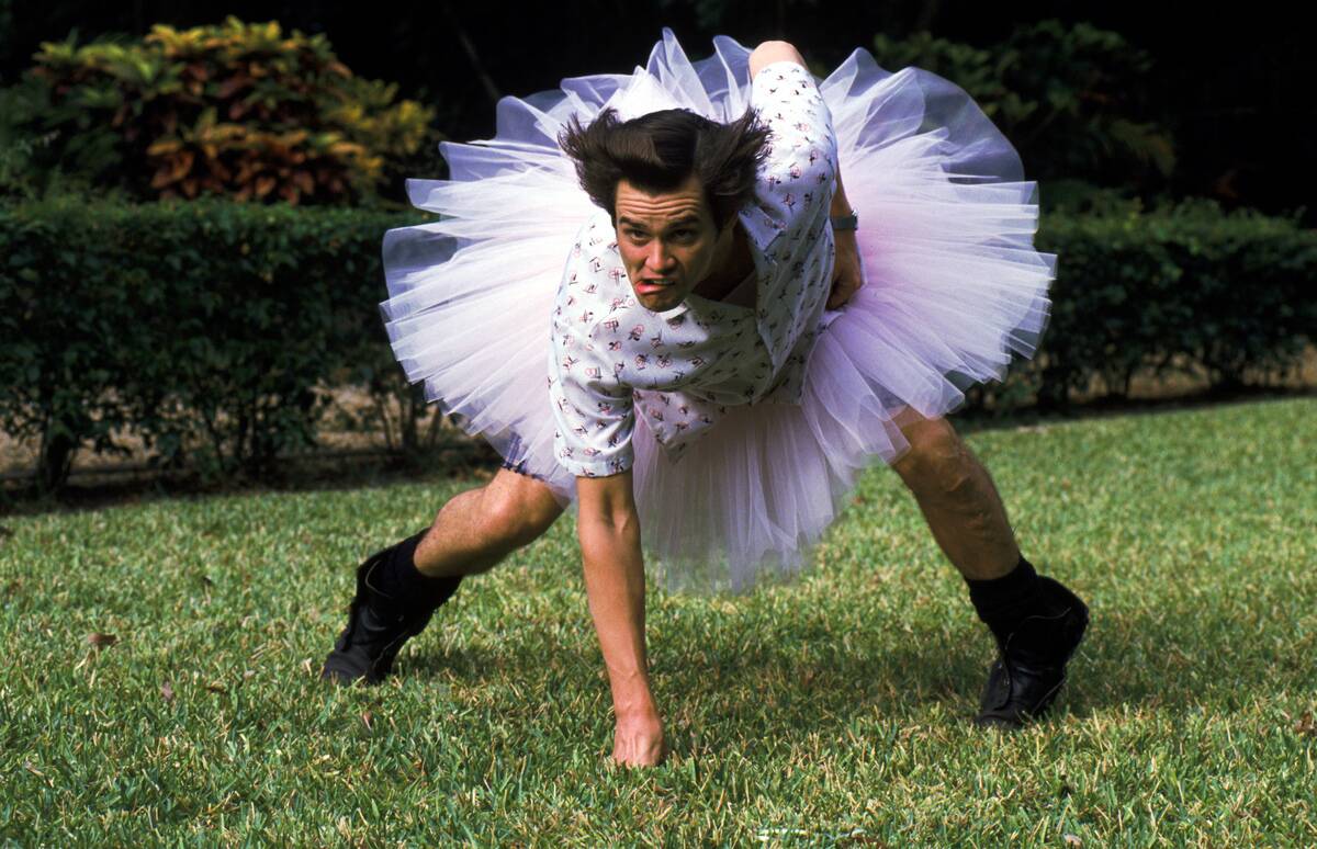 Jim Carrey crouching in tutu as Ace Ventura Pet Detective