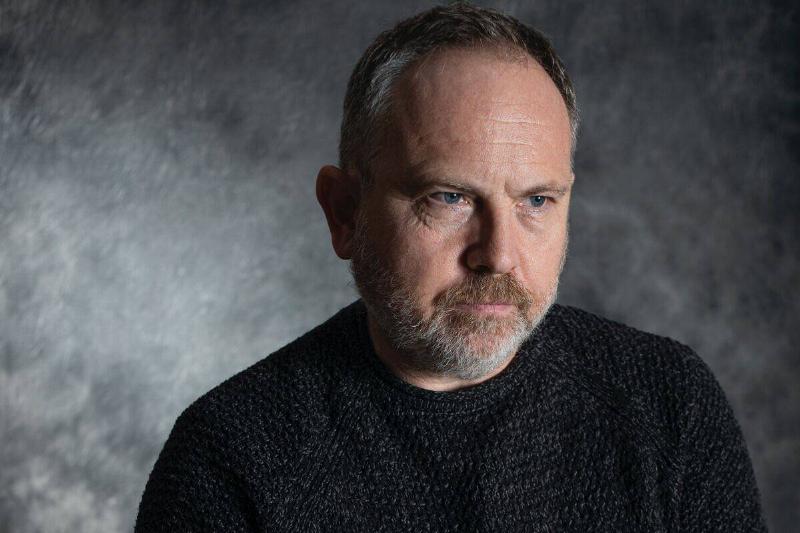 middle-aged man looking annoyed