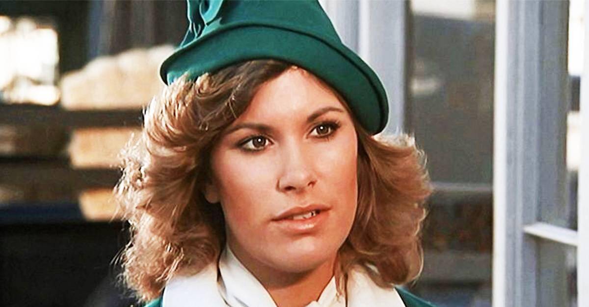 woman wearing a green hat