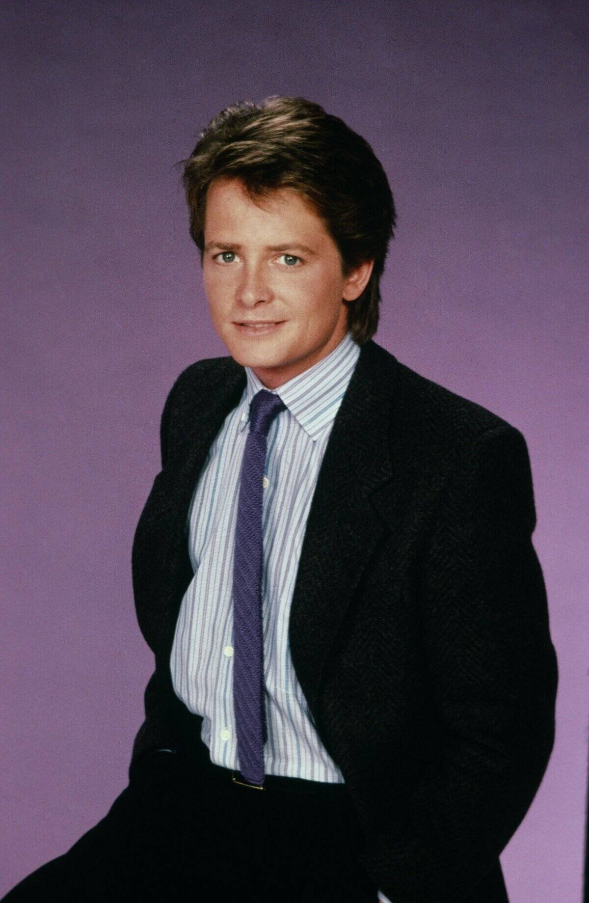 michael j. fox in front of a purple background