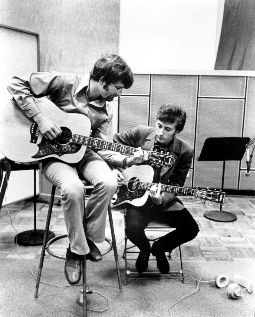 zager and evans playing guitar